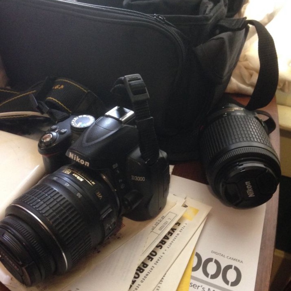 Nikon D3000 SLR camera with 2 zoom lenses and bag